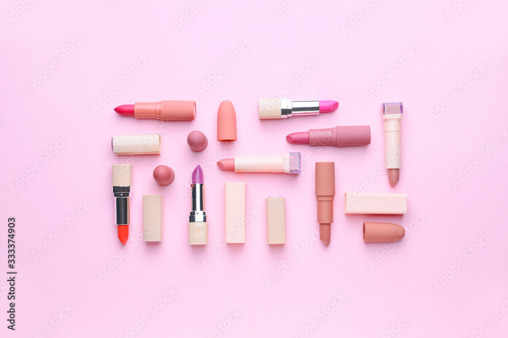 Naklejka premium Different lipsticks on color background