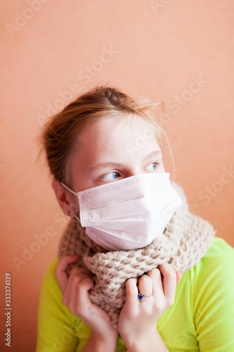  sick girl in mask is quarantined at home.