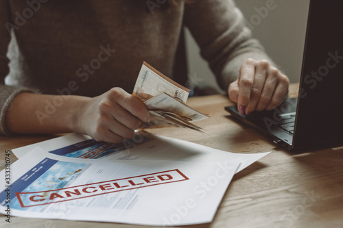 Woman Counting Euro Bills for Cancellation Compensation photo