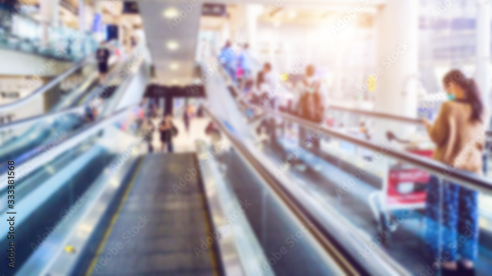 blurred Exhibition visitors at a escalator, People go on escalators in different directions. blurred Exhibition visitors at a escalator, People go on escalators in different directions.