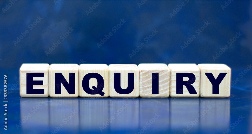 concept word ENQUIRY on cubes on a blue background