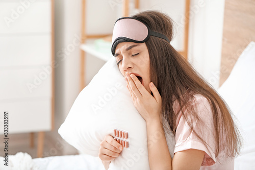 Tired woman with pills for ...