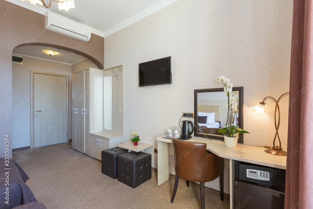 Interior of a small hotel room, entrance area
