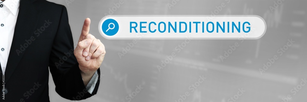 Fototapeta premium Reconditioning. Man in a suit points a finger at a search box. The word Reconditioning is in the search. Symbol for business, finance, statistics, analysis, economy