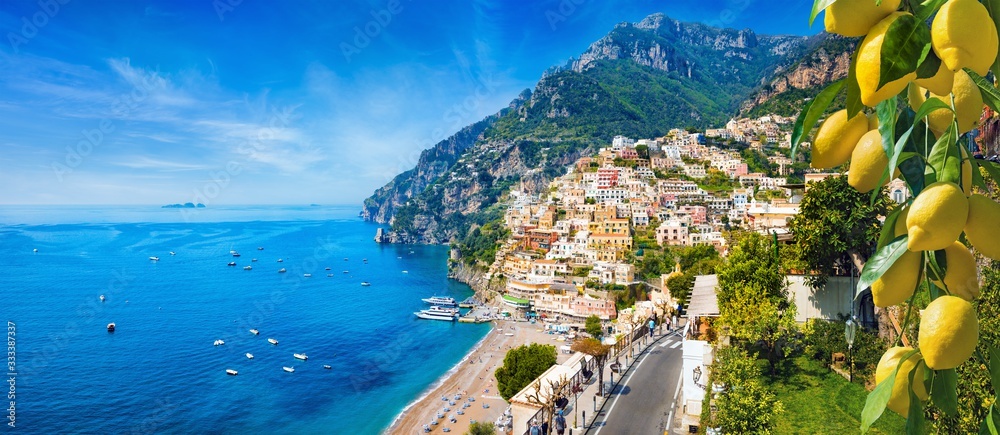 Panoramic view of Positano with comfortable beaches and blue sea on Amalfi Coast in Campania, Italy. Amalfi coast is popular travel and holyday destination in Europe.