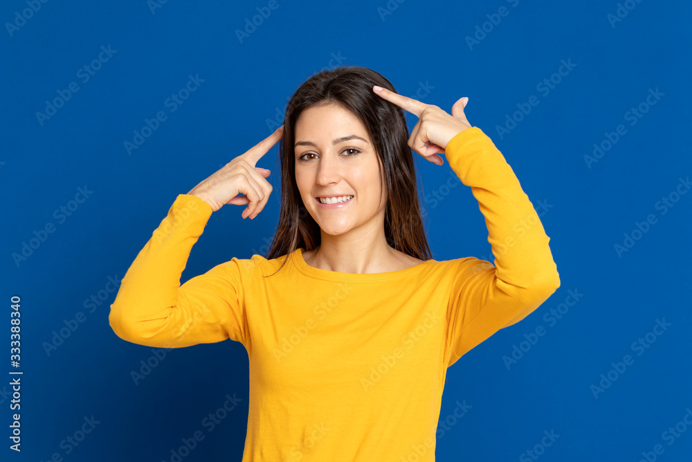 Fototapeta premium Brunette girl wearing a yellow T-shirt