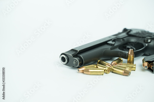 Black gun and ammunition on white background. Baretta 92