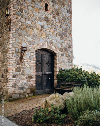 Castle tower door and a bench