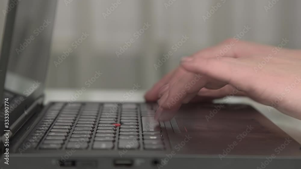 young woman hands with manicure open modern black notebook and tap buttons sitting at home extreme close view young woman hands with manicure open modern black notebook and tap buttons sitting at home extreme close view