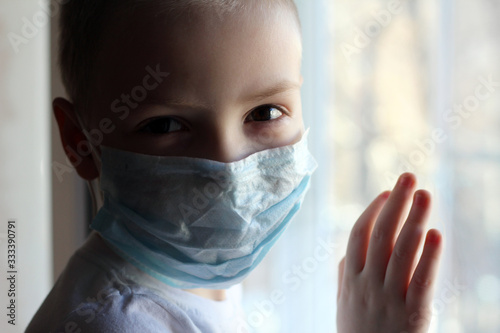 Toddler boy with a medical mask on his face Warning of the dangers of traveling to China and safety measures against coronavirus 2019 nKoV Coronavirus originating in Wuhan, China Close-up portrait