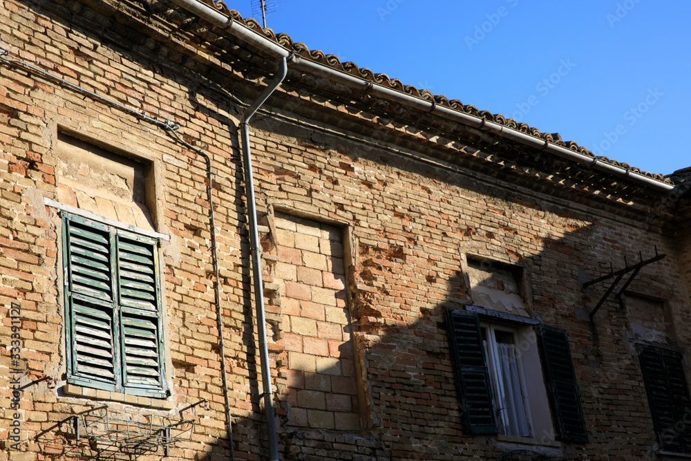 Corinaldo (AN), Italy - January 1, 2019: View of an old facade in Corinaldo village, Corinaldo,  Ancona, Marche, Italy