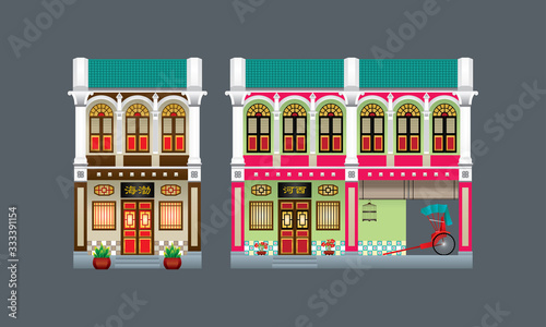 Double storey colorful and historical colonial style shop house. Isolated. Signboard's caption: the places where the owner's origin.