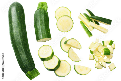 Fotografia fresh green zucchini slices isolated on white background