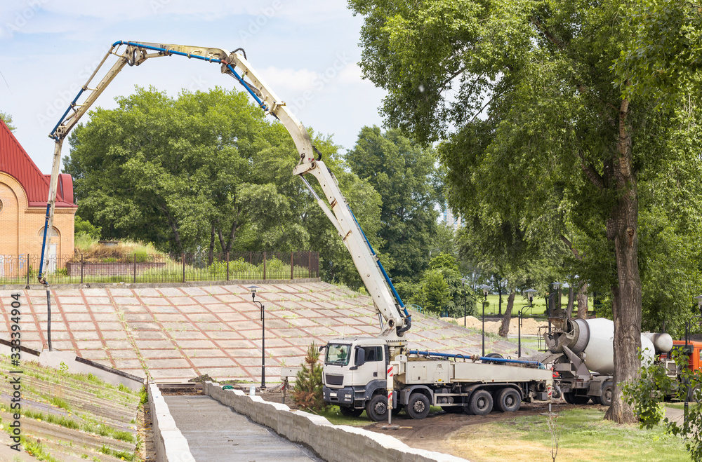 Truck mounted concrete pump on a construction site Truck mounted concrete pump on a construction site