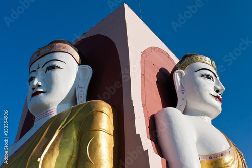 Seated giant Buddhas at Kyaik Pun Pagoda, Bago, Myanmar photo