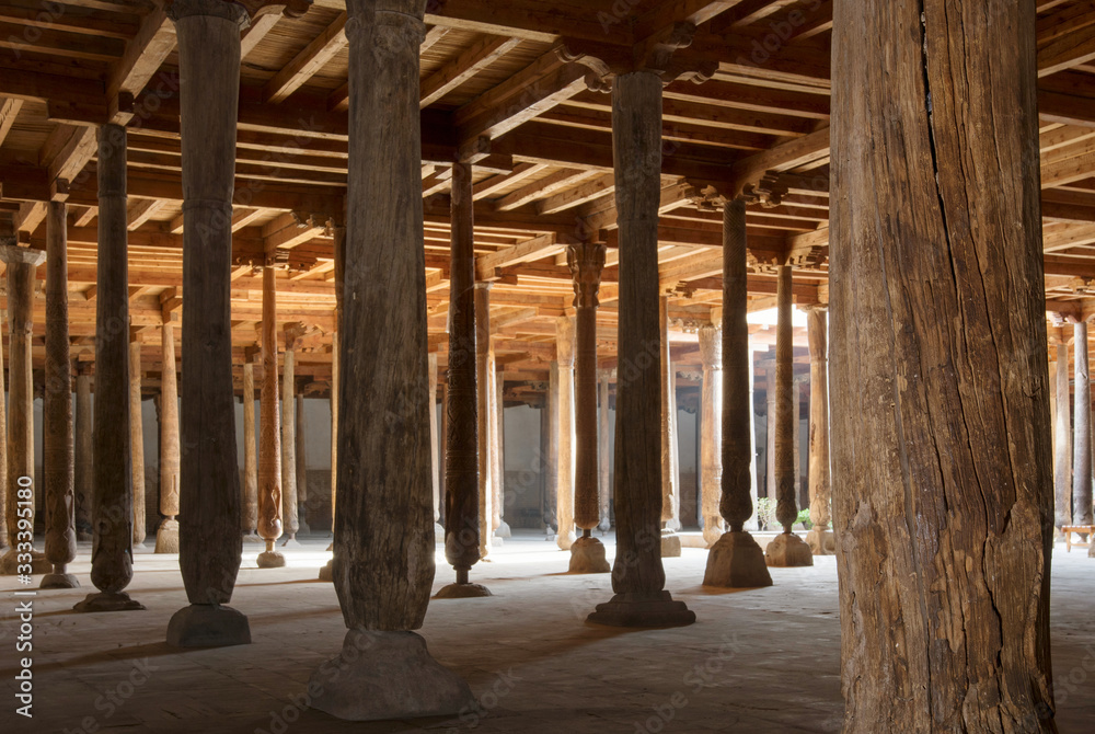 Main hall of Juma mosque (10th and 18th centuries) with old wooden pillars. Khiva, Uzbekistan, Central Asia