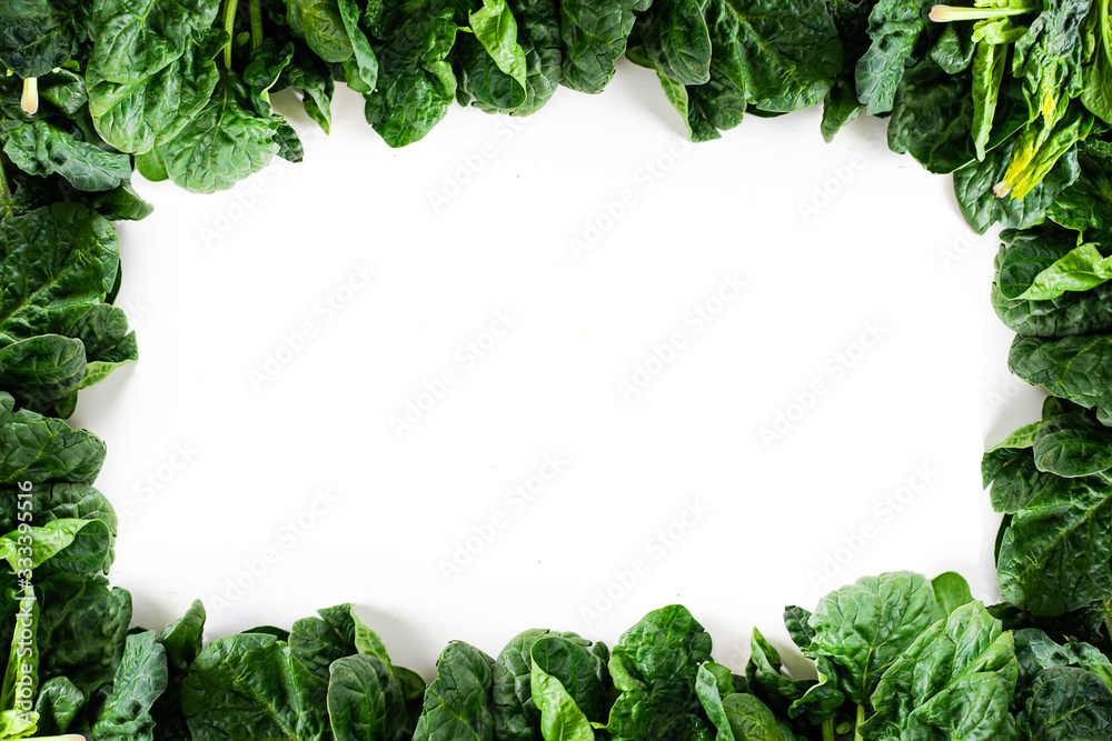Green vegetables. Green fruits and vegetables on a white background. Apples, parsley, spinach, arugula and lettuce on a white background. Top view. Spinach and vegetable smoothies with copy space Green vegetables. Green fruits and vegetables on a white background. Apples, parsley, spinach, arugula and lettuce on a white background. Top view. Spinach and vegetable smoothies with copy space