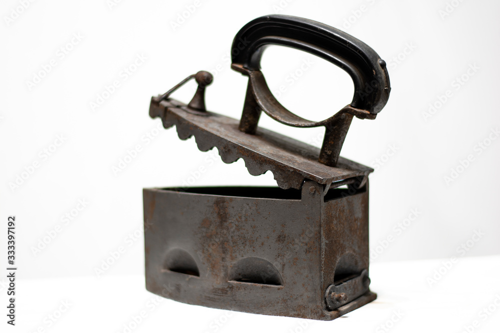 Antique coal iron isolated on white background Antique coal iron isolated on white background