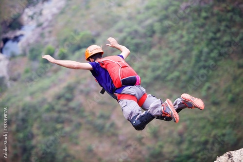 Man B.A.S.E jumping in the air