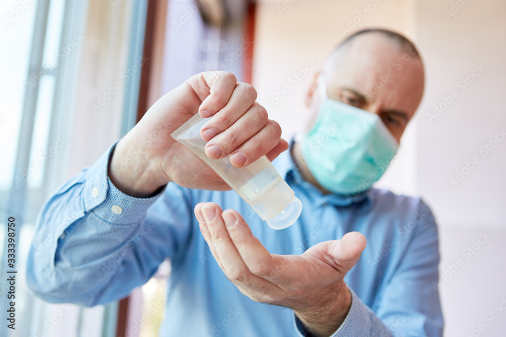 Senior in quarantine disinfecting hands Senior in quarantine disinfecting hands