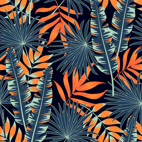 Colorful tropical seamless pattern with plants and leaves on a dark background. Exotic design for fabric, paper, cover, interior decor and other users. Hand draw texture. Vector template.