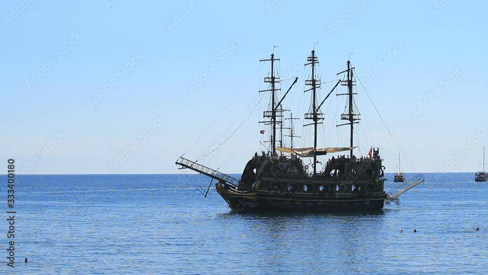 Pirate old frigate sails by sea In Kemer Pirate old frigate sails by sea In Kemer