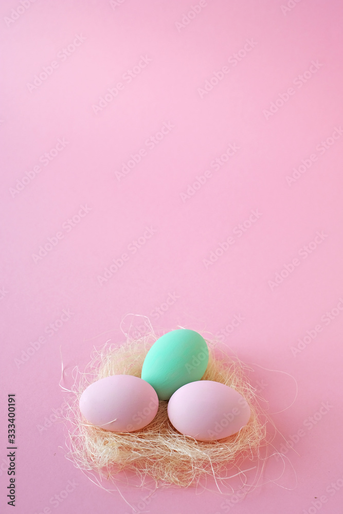 Eggs pink and mint color, several pink background. Easter concept