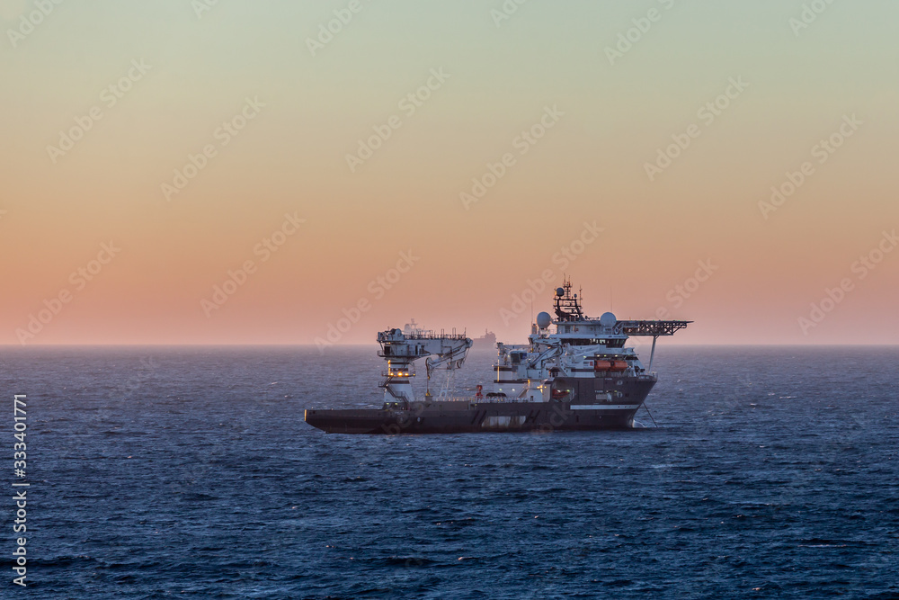 MONTROSE, SCOTLAND - 2015 NOVEMBER 01. Offshore Subsea Construction vessel Olympic Ares at sunrise.