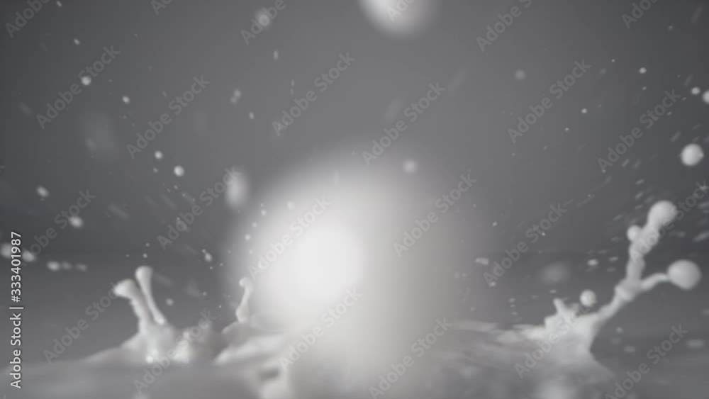 Slow motion of pouring milk stream, macro shot. 
