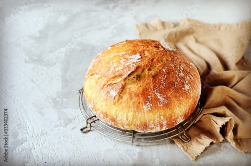 Tasty homemade bread on a gray background