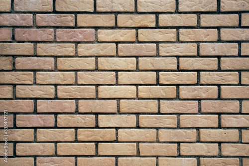 Background of light decorative brick wall texture.