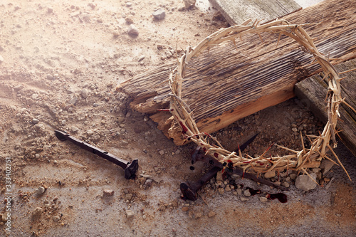 Фотография Easter background depicting the crucifixion with a rustic wooden cross, crown of thorns and nails