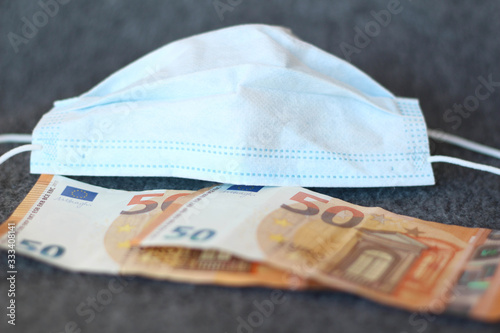 The concept of epidemic and protection against coronavrius. Can Wearing A Face Mask. Money in euro banknotes. Finance. 50 Euro cash. Fifty Euro Banknote. Stock photo photo