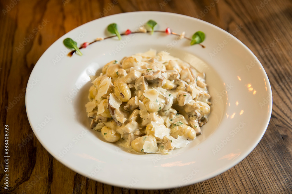 Gnocchi with turkey meat and porcini mushrooms in a cream sauce Gnocchi with turkey meat and porcini mushrooms in a cream sauce
