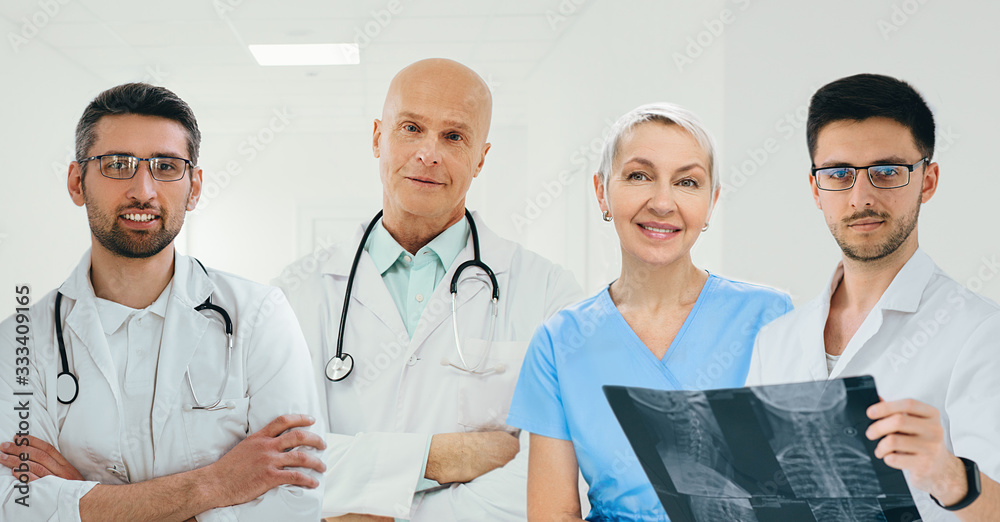 team of doctors and nurses standing at clinic. group of medical staff looking at camera team of doctors and nurses standing at clinic. group of medical staff looking at camera