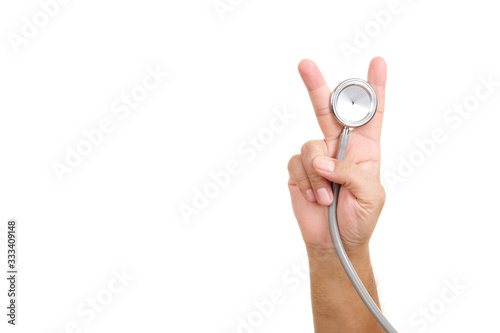 Doctor hands put V sign holding a stethoscope on white background. concept Healthy. Victory sign.