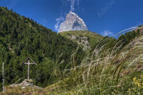 Matterhorn and wooden cross. Symbols of mountaineering and its victims. photo