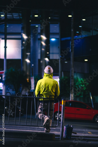 Construction Worker in High Visibility Jacket waiting at Tram Stop Melbourne CBD © Aspinall Photography