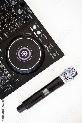  microphone and dj controller on a white background