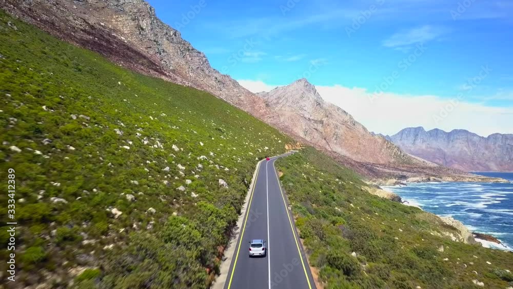 Car Driving along Sunny Mountainside Road & Coast, Garden Route South Africa, Aerial Tracking Forward
