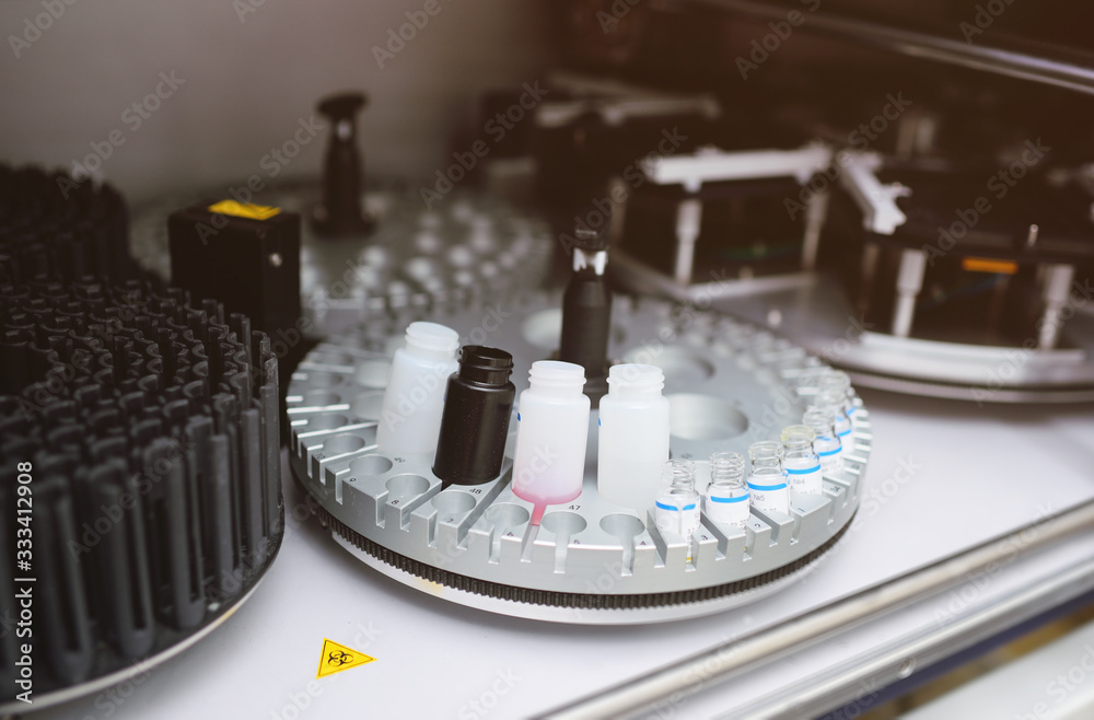 Modern equipment in the biochemical laboratory is a robotic computer analyzer. Mechanical needle that adds a reagent Modern equipment in the biochemical laboratory is a robotic computer analyzer. Mechanical needle that adds a reagent