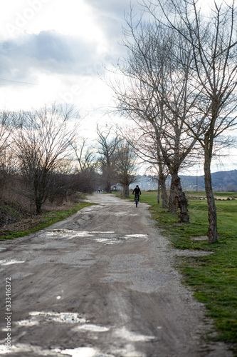 Cycling in the winter park, walking, sporting people