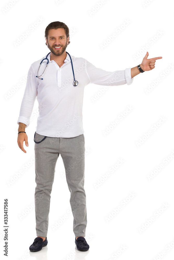 Handsome Male Doctor Is Smiling And Pointing At The Side Handsome Male Doctor Is Smiling And Pointing At The Side
