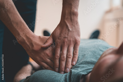 Physiotherapist treating patient for various physical ailments