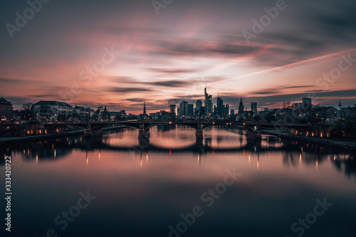 sunset over main river and Frankfurt skyline