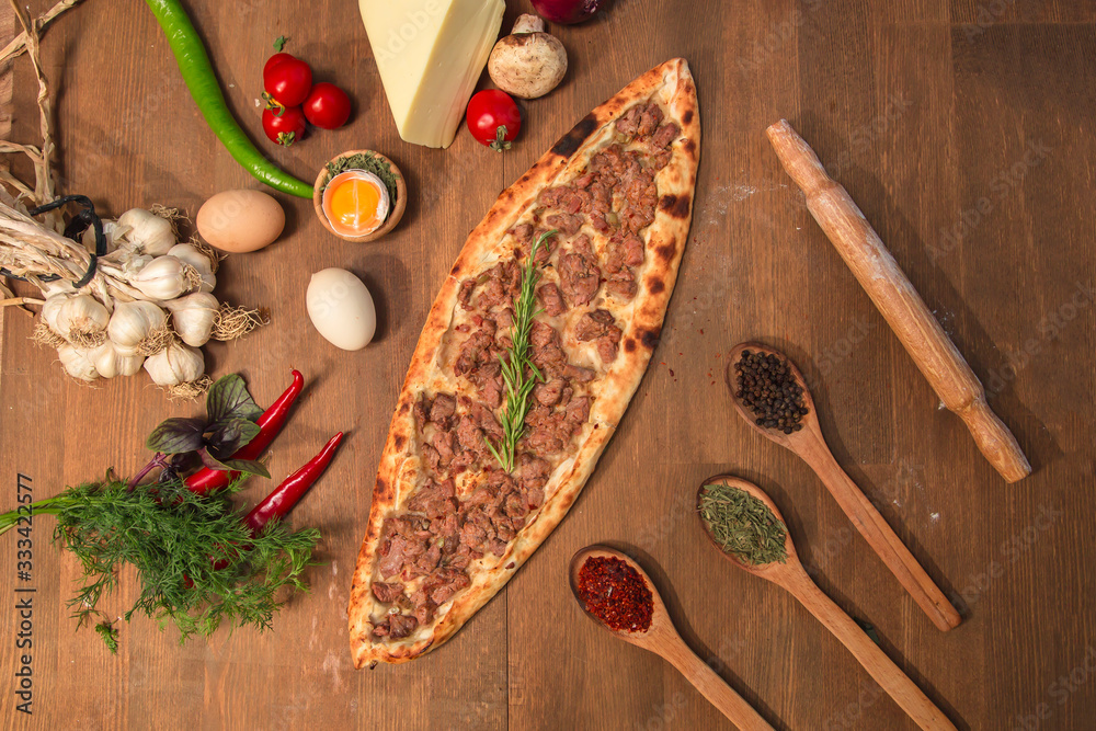 Pita from turkish cuisine on the wooden board Pita from turkish cuisine on the wooden board