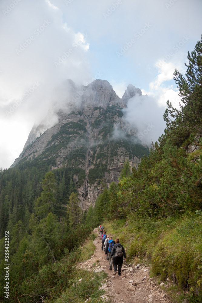 Dolomites Belluno, Veneto, Italy - august 31 2016: hikers walk towards Lake Sorapis.