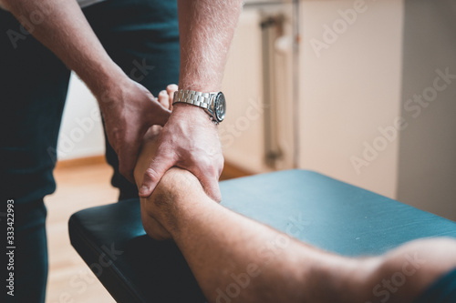 Canvas Print Physiotherapist treating patient for various physical ailments
