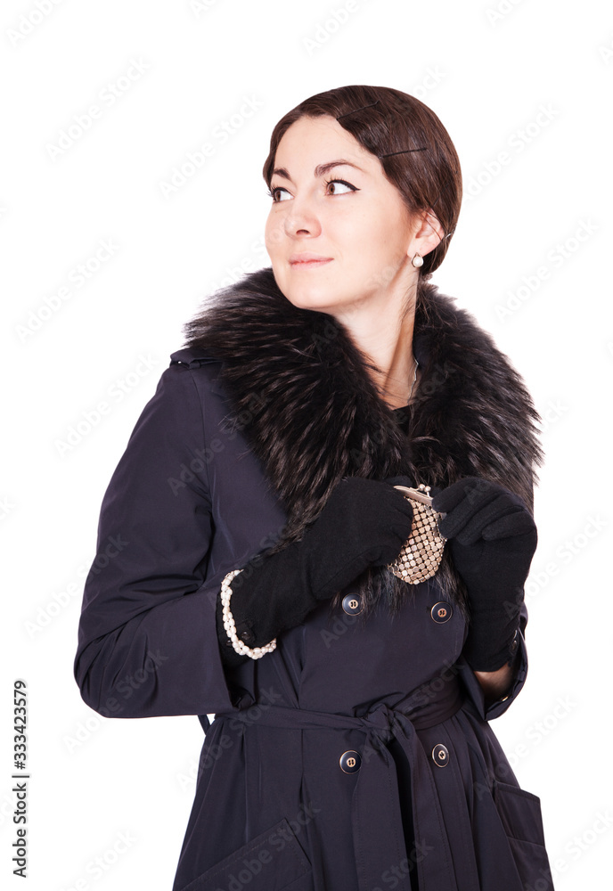Girl in a black coat holding purse Girl in a black coat holding purse