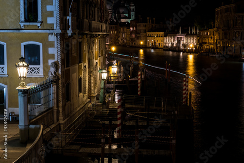 Venice canal with gondolas at night. Italy. Empty Venice  No tourists